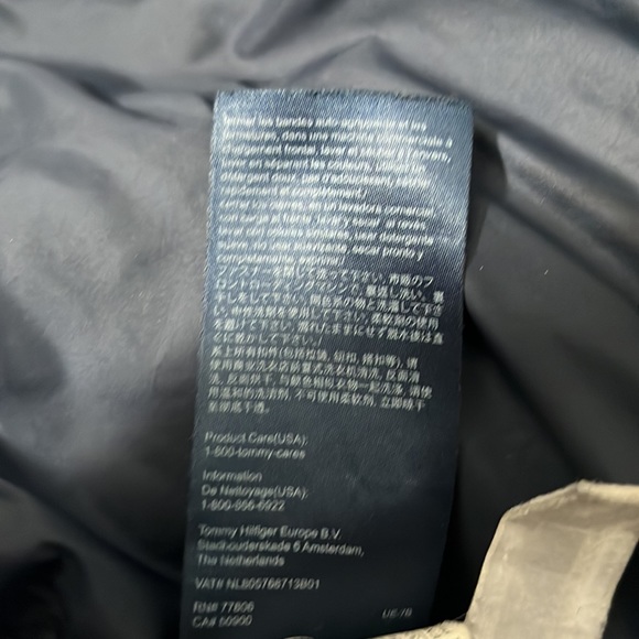Tommy Hilfiger winter jacket with a couple tears. - Picture 6 of 8